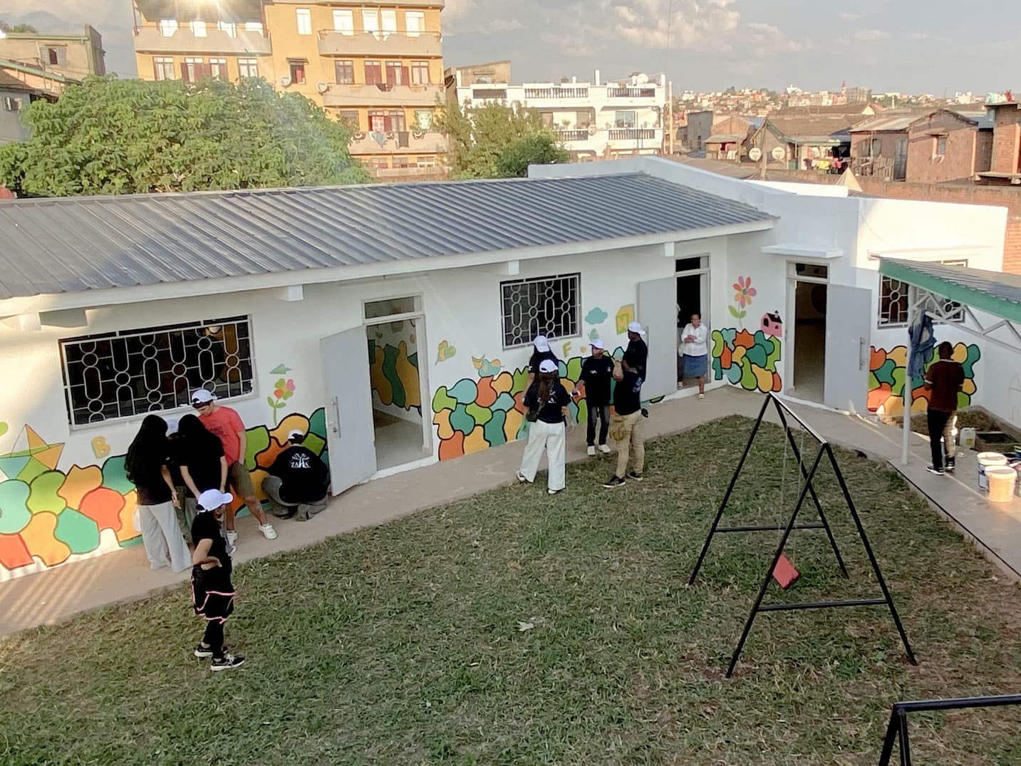 ZAHA volunteers painting a community mural